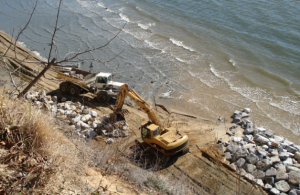 Coastal contractors used heavy road equipment to build the nearshore breakwater with 500 to 2000 lb. granite stone.